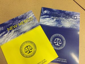 Blue and yellow booklets on a brown table
