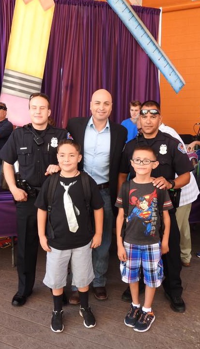 Protect Yourself Group of people including Attorney General, police officers, and children
